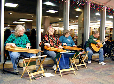 guitar and dulcimers group plays during the Christmas walk
