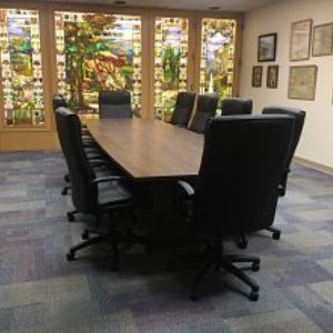 Board Room table and chairs, stained glass windows