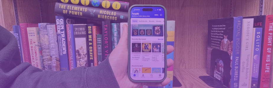 Hand holding phone open to a digital reading app.