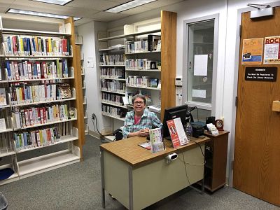 Computer and Bookshelf at the Community Health Branch.